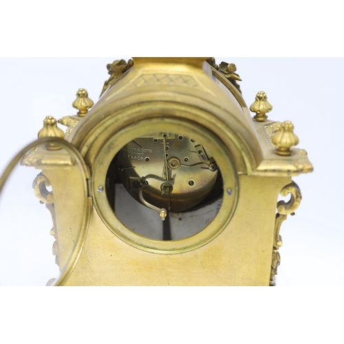 474 - A Sevres style ormolu clock, Miller & Sons with two similar gilt spelter urns, pendulum no key, 44cm... 