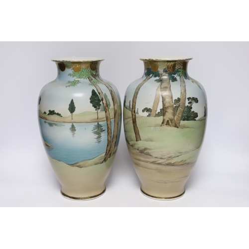 517 - A pair of early 20th century Japanese enamelled porcelain Bijin vases, 32cm