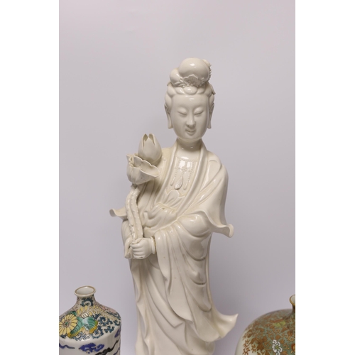 549 - A 19th century Chinese blanc de chine figure of Guanyin, 20th century dragon vase and a Japanese M... 