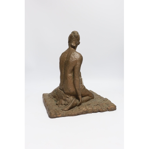 563 - An abstract bronzed resin sculpture of a kneeling man, 30cm