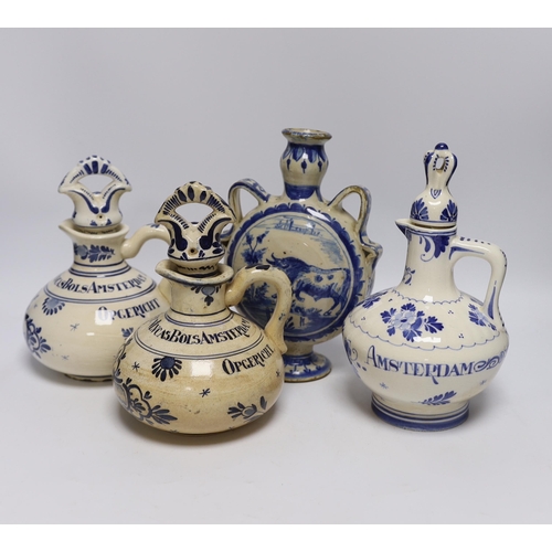 564 - A Delft moonflask and three Delft jugs, largest 22cm