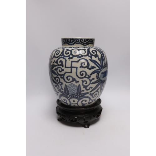 577 - A 19th century Chinese blue and white jar and cover, with stand, 29cm total (including stand)