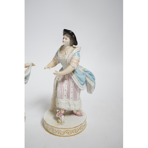 589 - A late Meissen porcelain figure of a young woman wearing a black jacket and floral skirt on circular... 