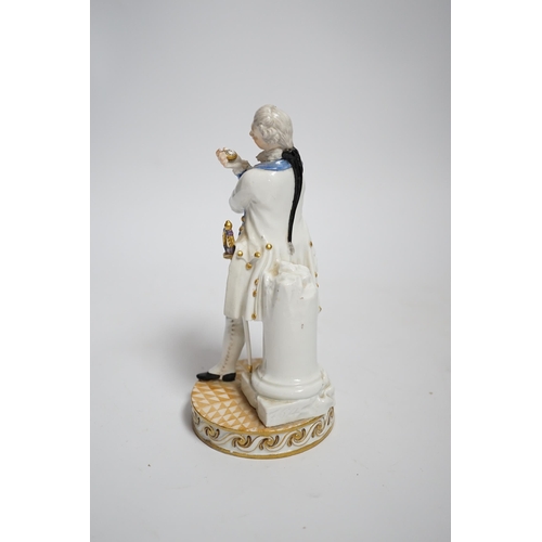 592 - A Meissen style porcelain figure of a soldier in dress uniform with sword and holding aloft a pocket... 