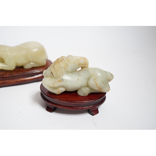 599 - Two Chinese carved jade figures of horses on stands, largest 11cm wide