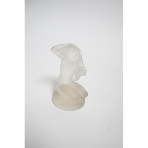 602 - A Lalique glass figure of a kneeling female, signed, 8cm high