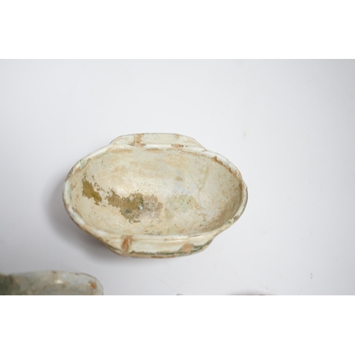 604 - A Chinese glazed pottery ear cup and similar spoon, Han dynasty, and a pottery figure, Song dynast... 