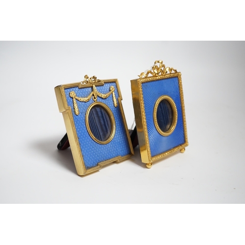 611 - Two gilt metal and enamel miniature frames with fitted cases, largest 11cm high