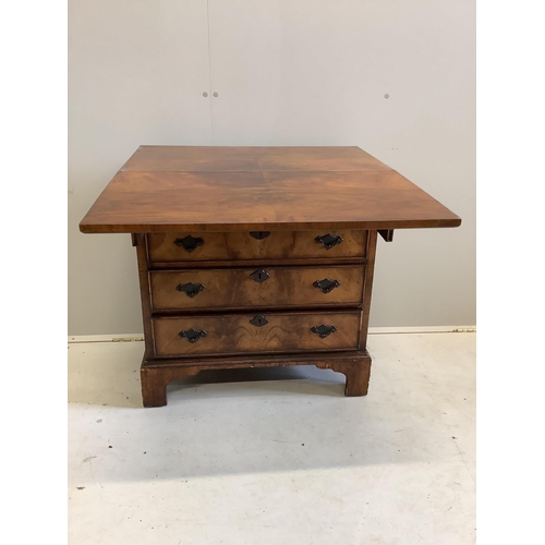 65 - A good quality reproduction feather-banded walnut batchelors chest of four drawers, raised on brack... 