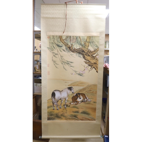 653 - After Giuseppe Castiglione, a Chinese style scroll painting of horses, 188cm in length overall... 