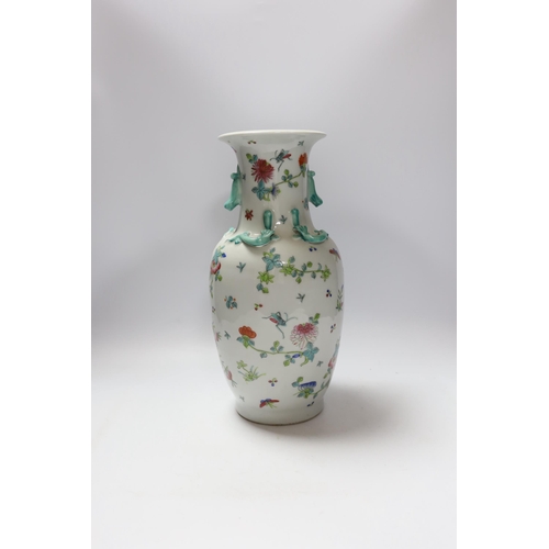 659 - A Chinese famille rose vase, 20th century, with a drilled base, intended to be converted to a lamp, ... 