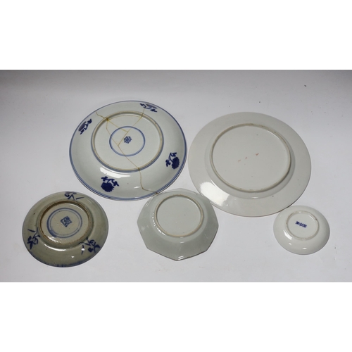 670 - A group of 18th century Chinese porcelain plates and saucers, mostly blue and white and an octagonal... 