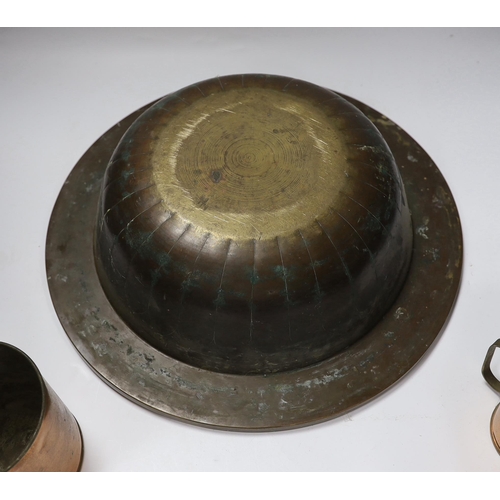 672 - A miner's brass Davy lamp, signed E.Thomas & Williams, a large brass bowl and three graduated copper... 