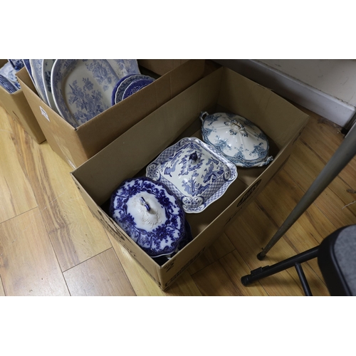 673 - A collection of 19th / 20th century blue and white pottery including platters, tureens and jugs... 