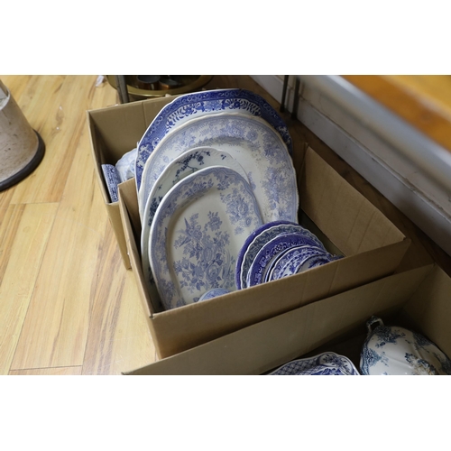 673 - A collection of 19th / 20th century blue and white pottery including platters, tureens and jugs... 