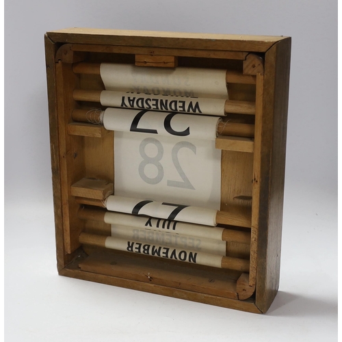 677 - A 20th century wall hanging calendar, 33cm high