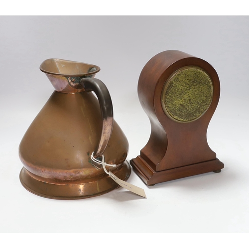 680 - A copper measure jug and a mantel clock