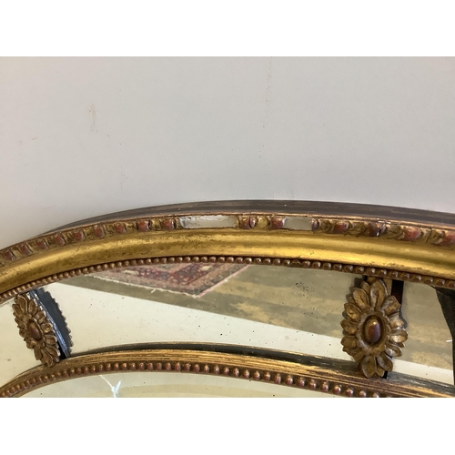 70 - A Victorian Adam style oval giltwood and composition wall mirror with marginal plate, width 81cm, he... 