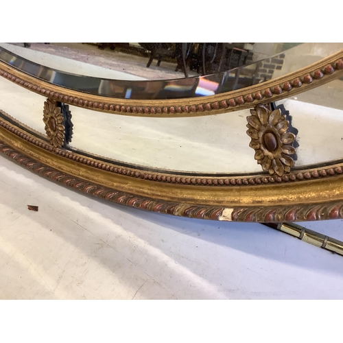 70 - A Victorian Adam style oval giltwood and composition wall mirror with marginal plate, width 81cm, he... 