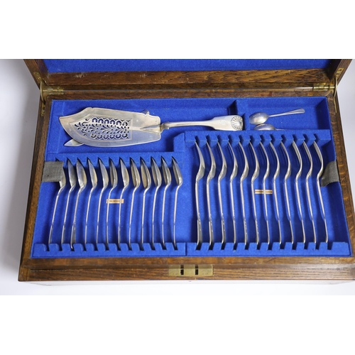 827 - A Victorian oak cased matched canteen of silver fiddle and shell pattern flatware, by John & Henry L... 