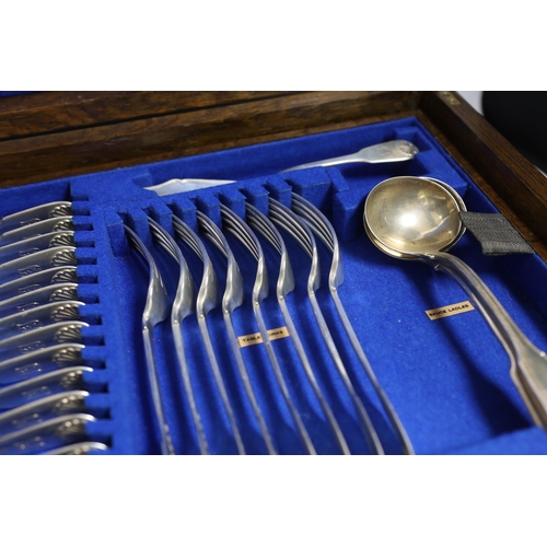 827 - A Victorian oak cased matched canteen of silver fiddle and shell pattern flatware, by John & Henry L... 