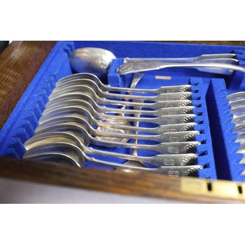 827 - A Victorian oak cased matched canteen of silver fiddle and shell pattern flatware, by John & Henry L... 