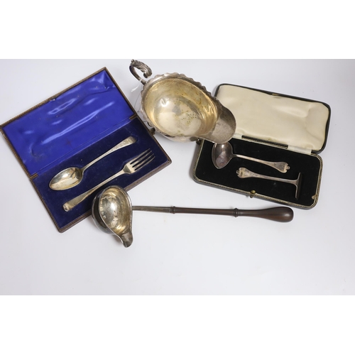 833 - A small group of silver items to include a George V sauceboat, London, 1934, a George III toddy ladl... 