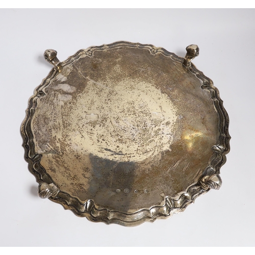 845 - A large George II silver shaped circular salver, with pie crust border and engraved armorial, on fou... 