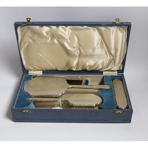 854 - A cased George VI silver mounted four piece dressing table set, by Walker & Hall, Sheffield 1937.... 