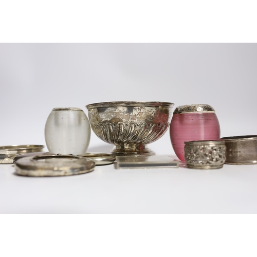 856 - A collection of small silver, to include two mounted glass match strikes, one with cranberry glass, ... 