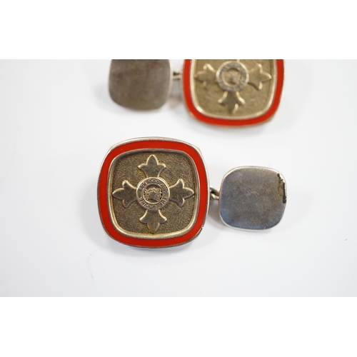 900 - A modern pair of silver and red enamel cufflinks, embossed with the Order of The British Empire, by ... 