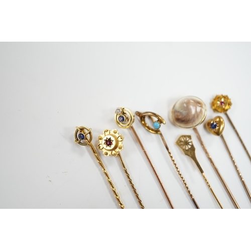 902 - Eight assorted early 20th century and later yellow metal and gem set stick pins, including six 15ct,... 