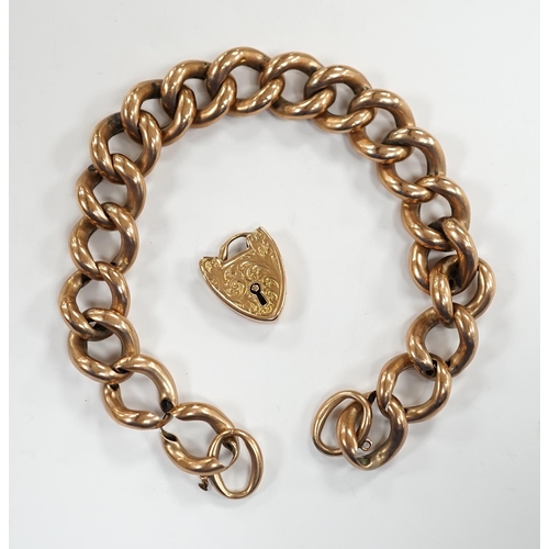 906 - An Edwardian 9ct gold hollow curb link bracelet, with heart shaped padlock clasp(a.f.), 20cm, 23 gra... 