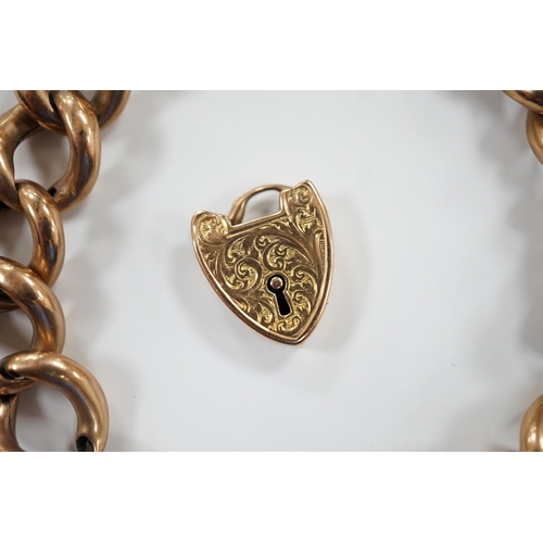 906 - An Edwardian 9ct gold hollow curb link bracelet, with heart shaped padlock clasp(a.f.), 20cm, 23 gra... 