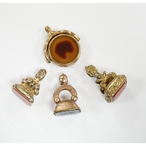 911 - Four assorted 19th century fob seals including a 9ct and chalcedony set spinning fob, 32mm.