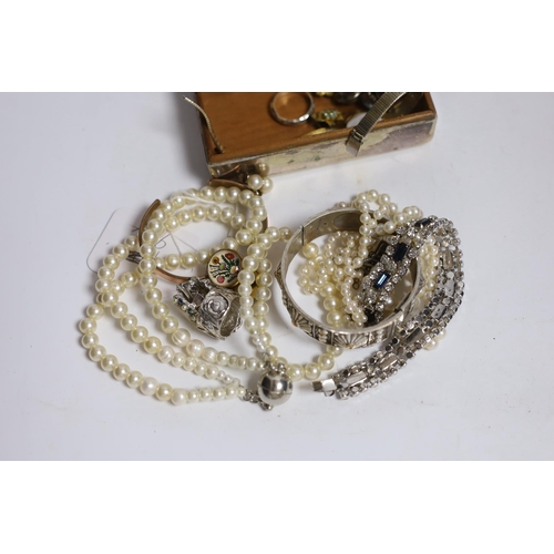 914 - A double strand graduated cultured pearl necklace, with paste set white metal clasp, 44cm, a pair of... 