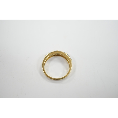 918 - A modern 18ct gold and seven stone diamond set half hoop ring, size N, gross weight 4 grams.