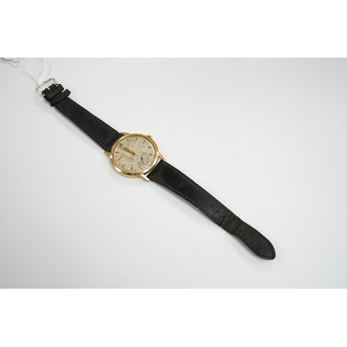 921 - A gentleman's 18k Omega manual wind wrist watch, on a later associated leather strap, case diameter ... 