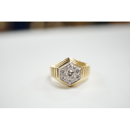 930 - A modern 18ct gold and diamond set hexagonal cluster ring, size Q, gross weight 11.3 grams.