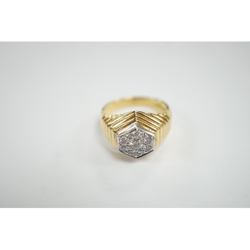 930 - A modern 18ct gold and diamond set hexagonal cluster ring, size Q, gross weight 11.3 grams.