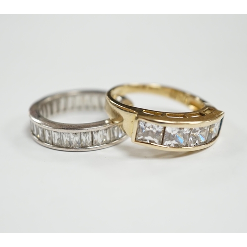 932 - A 9k and simulated diamond set half hoop ring and a 925 and simulated diamond set eternity ring.... 