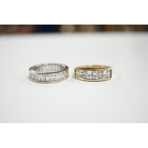 932 - A 9k and simulated diamond set half hoop ring and a 925 and simulated diamond set eternity ring.... 