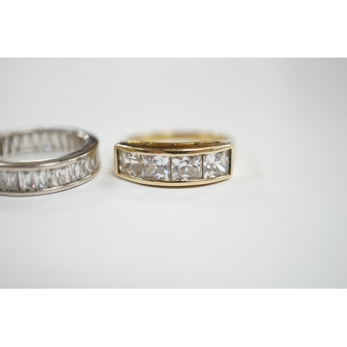 932 - A 9k and simulated diamond set half hoop ring and a 925 and simulated diamond set eternity ring.... 