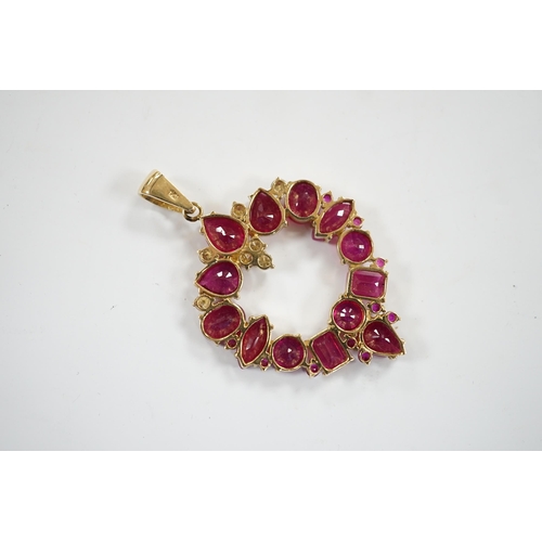 941 - A modern 14k, ruby(treated) and diamond cluster set open work pendant, overall 52mm, gross weight 10... 