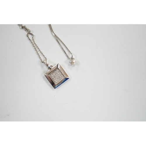 944 - A modern Italian 18k white metal and diamond chip set pendant, on an 18k chain, 42cm and a white met... 