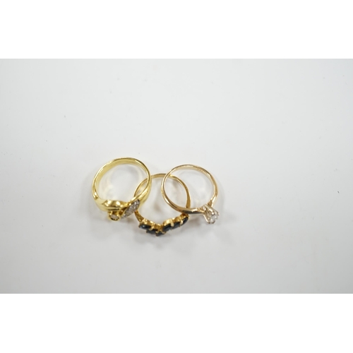 948 - Three assorted modern 14k and gem set rings, including single stone marquise cut diamond, diamond ch... 