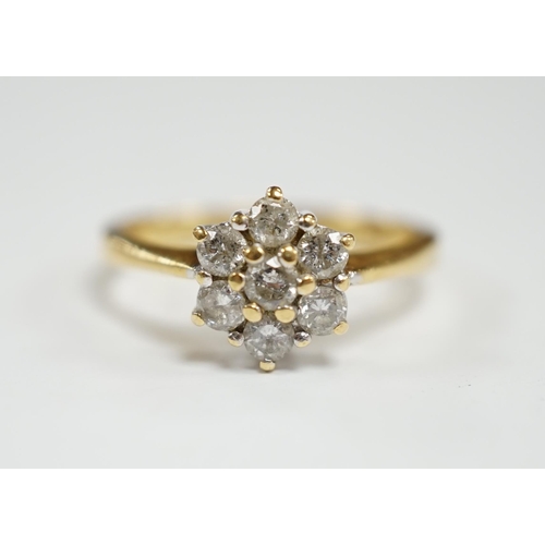 952 - A modern 18ct gold and seven stone diamond cluster set flower head ring, size N, gross weight  3.6 g... 