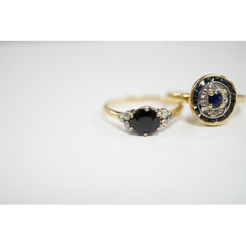 954 - An 18ct, sapphire and diamond set seven stone ring, size P and a French 18k and sapphire set oval cl... 