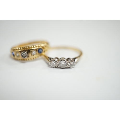 956 - An 18ct, plat and three stone diamond set ring, size K and a late Victorian 18ct gold three stone di... 