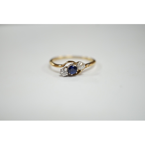 959 - An 18ct, single stone sapphire and two stone diamond set crossover ring, size O, gross weight 2.2 gr... 